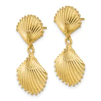 A pair of gold seashell-shaped dangle earrings with ribbed detailing and post backs, displayed against a white background.