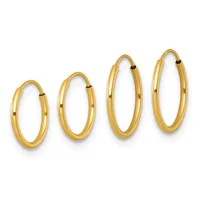 Four gold hoop earrings in increasing sizes arranged in a row, each with a polished finish and hinged closure.