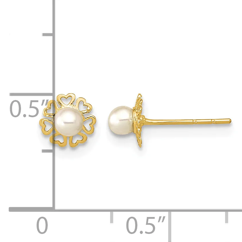 Pair of gold stud earrings featuring cream pearls surrounded by heart-shaped gold filigree, shown with a measurement scale indicating approximately half-inch diameter.