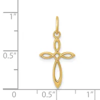 A gold cross pendant with interlocking oval cutout design, shown against a measurement scale indicating approximately one inch in height.