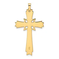A gold cross pendant with decorative cutouts on the horizontal arms and a small hallmark stamped near the bottom.