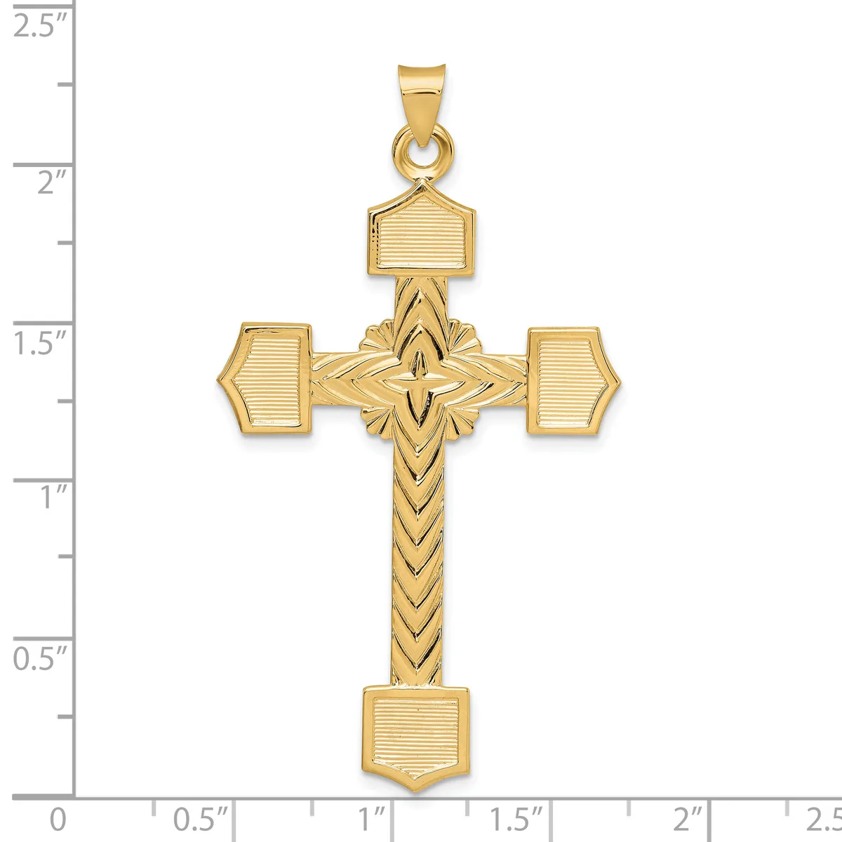 Gold cross pendant with textured rectangular terminals on the arms and a chevron-patterned shaft, displayed against a ruler showing approximately 2.25 inches in height.