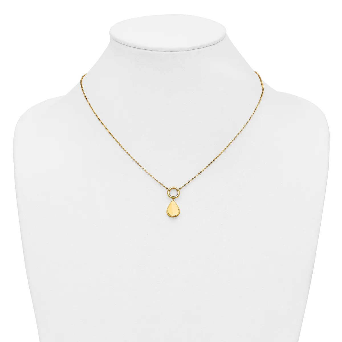 A gold-toned necklace with a delicate chain featuring a small circular connector and a smooth teardrop-shaped pendant, displayed on a white mannequin bust.