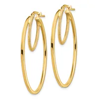 A pair of gold hoop earrings with polished and textured finishes, featuring double oval loops connected by post and clutch closures.