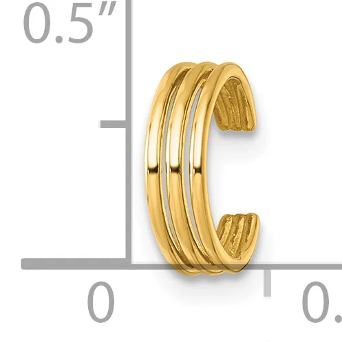 Gold-toned cuff bracelet with four parallel polished bands, shown next to a ruler indicating approximately 0.5 inches in width.