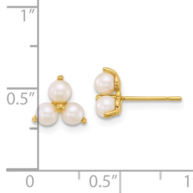 A pair of gold stud earrings each featuring three white pearls arranged in a triangular cluster, displayed next to a ruler showing approximately half an inch in height.