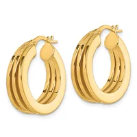 Pair of gold-colored hoop earrings with a grooved textured surface and post-and-clutch backs, displayed against a white background.