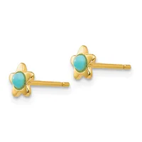 Pair of gold star-shaped stud earrings with oval turquoise cabochon centers and matching posts.