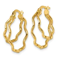 A pair of gold twisted hoop earrings with textured wavy surfaces and hinged closures, displayed side by side.