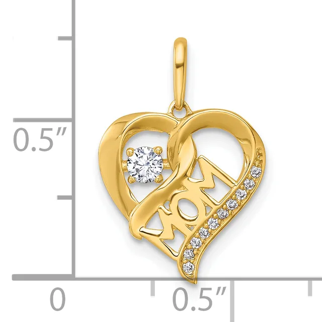 Gold heart-shaped pendant with cutout "MOM" text, a round diamond at top left, and small diamonds along the bottom curve, shown next to a ruler.