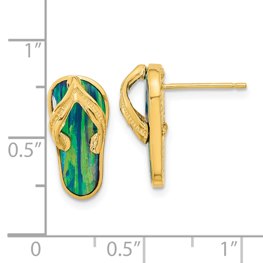 A pair of gold flip-flop shaped earrings with green and blue enameled soles and textured gold straps, shown next to a measurement scale.