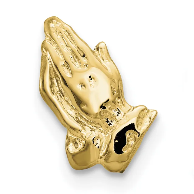 Gold-colored praying hands charm with textured details and small black gemstones, shown against a white background.
