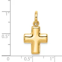 A gold cross pendant with rounded edges and a polished finish, shown against a measurement scale indicating approximately one inch in height.