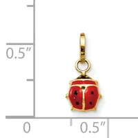 A gold-toned ladybug charm with red enamel wings dotted with black spots, shown next to a ruler indicating its size is approximately half an inch.