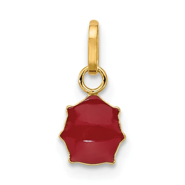 A gold-toned charm pendant with a scalloped red stone or enamel drop suspended from a small loop and ring.
