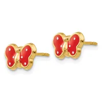 A pair of gold butterfly stud earrings with red enamel wings dotted with white spots.