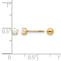 A pair of gold stud earrings with pearl tops displayed next to a matching gold ball stud, shown against a measurement scale.