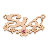 Rose gold ornamental pendant with scrollwork and floral details, featuring a small round purple gemstone in the center and two loops at the top.