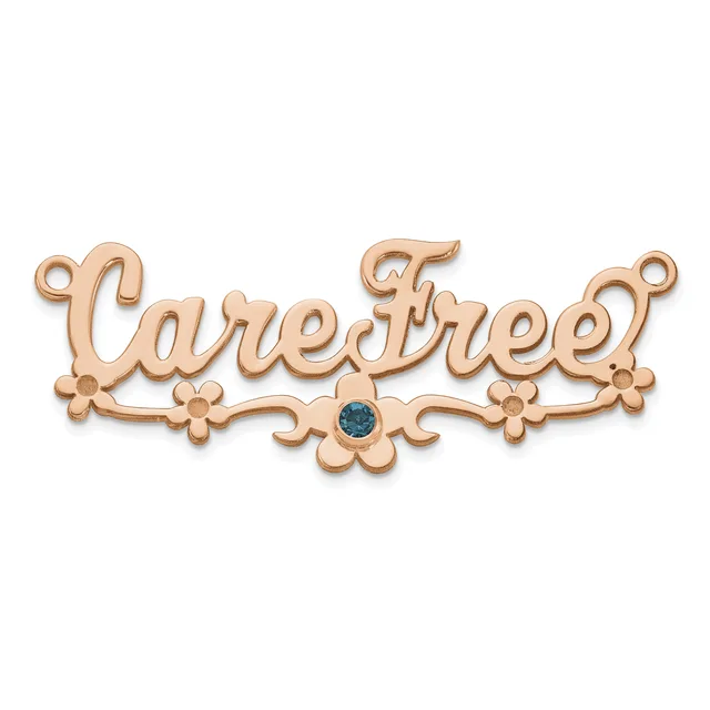 Rose gold decorative connector pendant with scrollwork and floral details, featuring a small blue gemstone in the center and loops at each end.