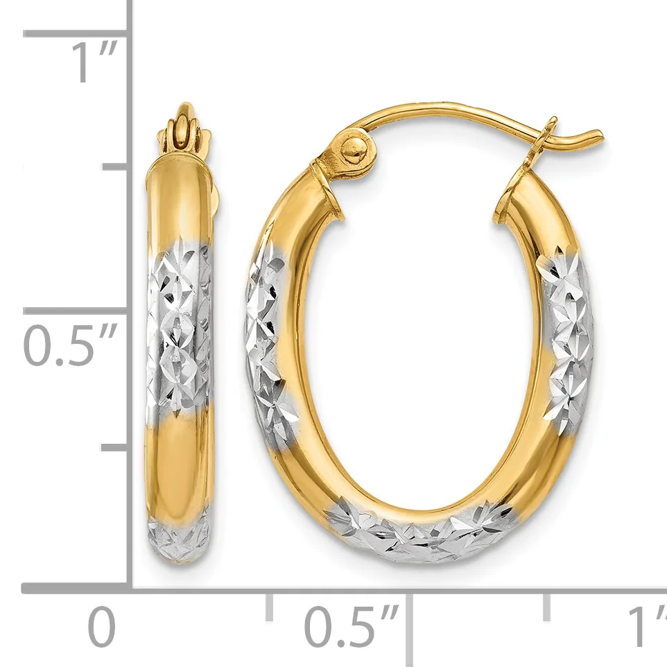 Pair of two-tone gold oval hoop earrings with textured white gold lower halves and polished yellow gold upper halves, shown with a measurement scale.