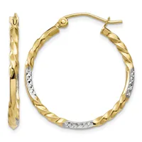 A pair of two-tone gold hoop earrings with twisted texture on the yellow gold exterior and diamond-cut detailing on the white gold interior sections, shown from front and side views.