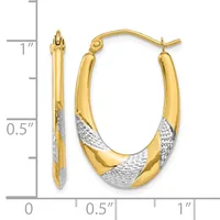Pair of two-tone gold hoop earrings with textured white gold sections, shown next to a ruler measuring approximately one inch in length.