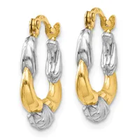 A pair of two-tone hoop earrings with textured white and polished yellow gold sections, featuring hinged posts with small hallmarks.