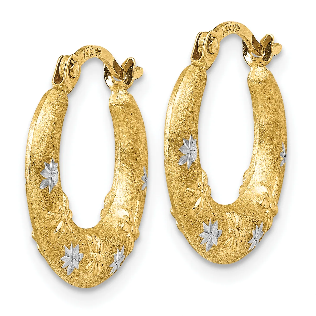 A pair of gold oval hoop earrings with a brushed finish, decorated with white star inlays and embossed leaf designs, displayed against a white background.
