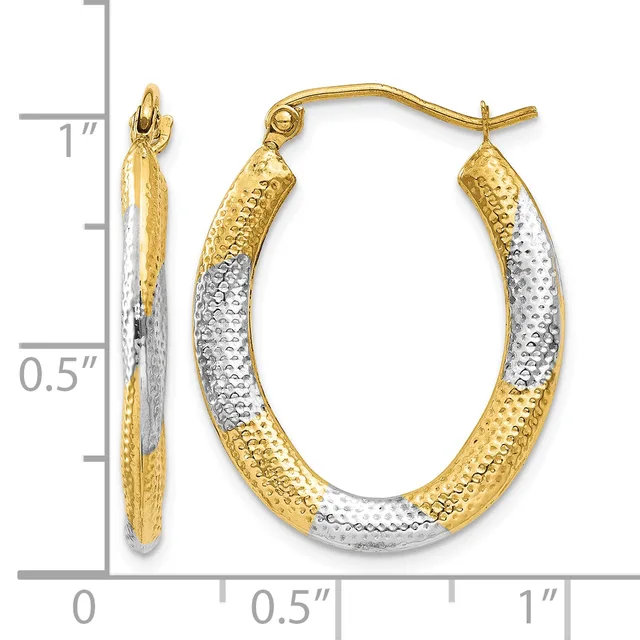 A pair of two-tone gold hoop earrings with textured surfaces, measuring approximately one inch in length, displayed against a measurement scale.