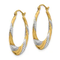 Pair of two-tone gold hoop earrings with twisted white gold accents and hinged closures.