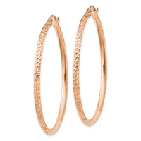 A pair of rose gold hoop earrings with textured outer surfaces and smooth inner surfaces, shown against a white background.