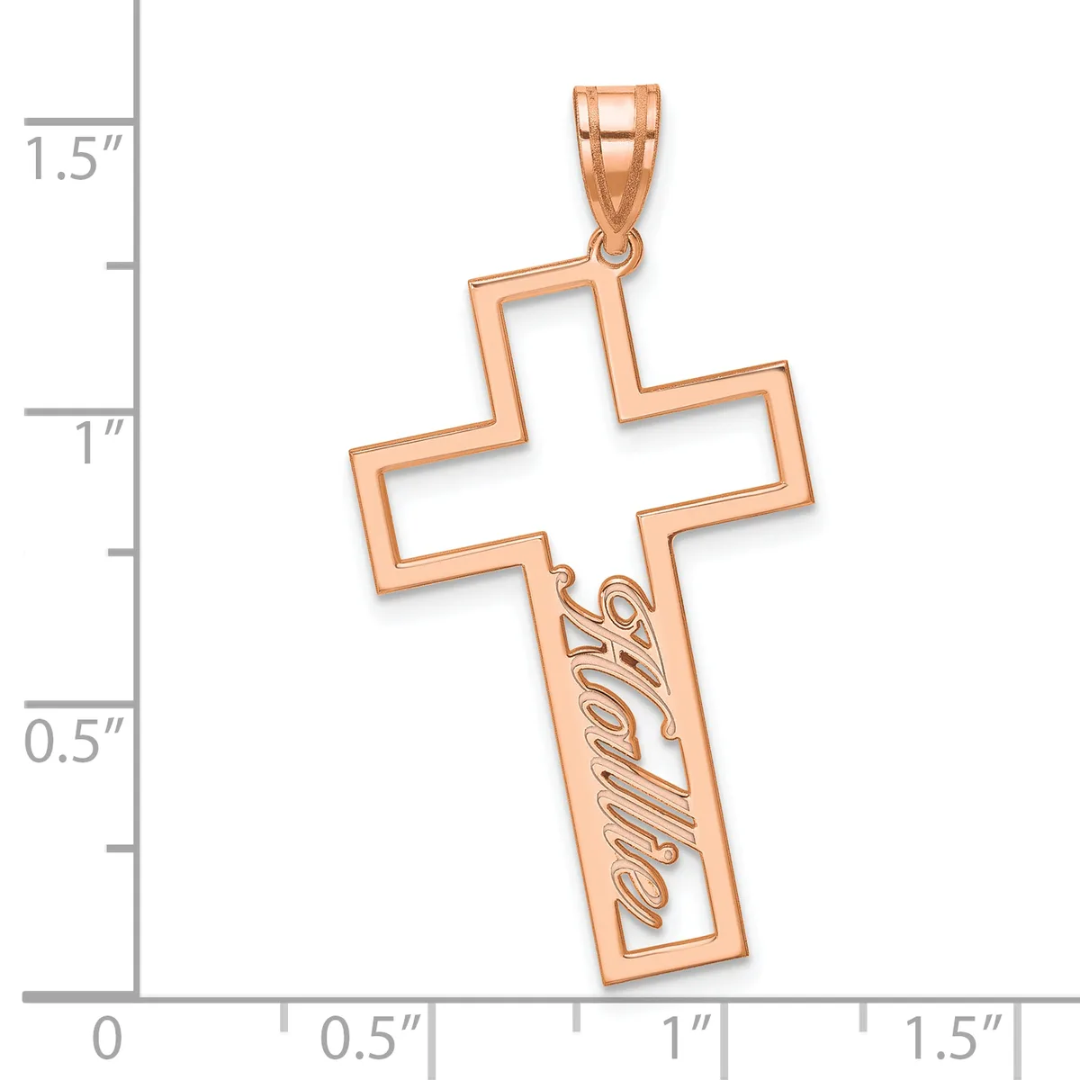 Rose gold cross pendant with cutout design and decorative script text on the lower arm, shown against a measurement scale.