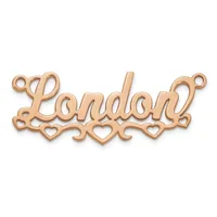 Rose gold pendant with the word "London" in script lettering, decorated with small hearts along the bottom and loops at each end for attachment.