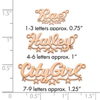 Three copper-colored metal name pendants with decorative stars displayed against a measurement ruler showing sizes ranging from 0.75 to 1.25 inches in height.