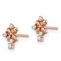 Pair of rose gold stud earrings with four-petal flower designs featuring round white diamonds set in polished metal settings.