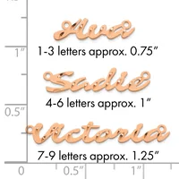 Three rose gold-colored script name pendants shown at actual size on a measurement ruler, ranging from approximately 0.75 inches for 1-3 letters to 1.25 inches for 7-9 letters.