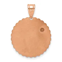 Rose gold circular pendant with scalloped edges and a small round stone accent, suspended from a matching bail.
