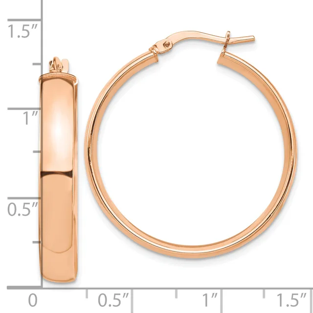Rose gold hoop earrings with a polished finish and post backs, displayed next to a measurement scale showing approximately 1.25 inches in diameter.