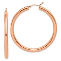 A pair of polished rose gold hoop earrings displayed side by side, one shown from the front and one from the side, with hinged closures.