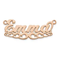 Rose gold-toned metal nameplate pendant with decorative scrollwork borders and two small loops at the top for attachment.