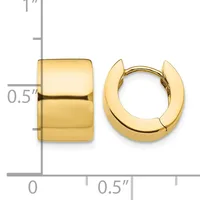 A pair of polished gold huggie hoop earrings displayed next to a ruler showing their width is approximately one-half inch.