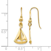 Pair of gold sailboat charm earrings with shepherd's hook wires, shown next to a ruler indicating approximately one inch in length.