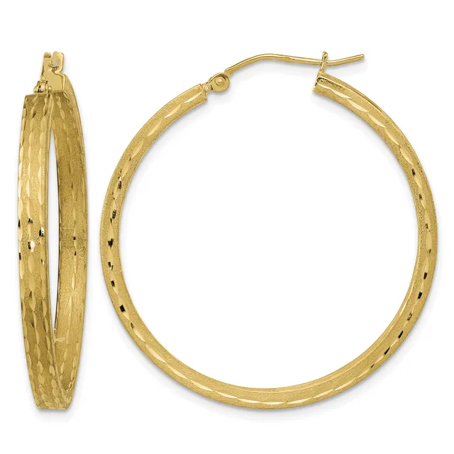 A pair of gold hoop earrings with a textured surface and small black speckled details, shown from front and side views.