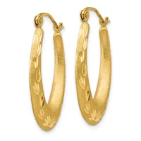 A pair of gold hoop earrings with a textured satin finish and decorative leaf engravings along the lower portion, shown against a white background.