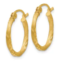 A pair of gold hoop earrings with a textured satin finish and polished accents, featuring hinged clasp closures at the top.