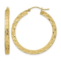 A pair of gold hoop earrings with a diamond-cut textured surface, shown from the front and side view.