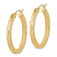 A pair of gold hoop earrings with textured diamond-cut surfaces and polished smooth inner edges, shown from the front against a white background.
