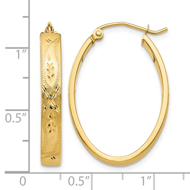 Gold-colored oval hoop earrings with textured surface and matching textured rectangular pendant, displayed next to a measurement ruler showing approximately one inch in length.