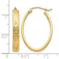 Gold-colored oval hoop earrings with textured surface and matching textured rectangular pendant, displayed next to a measurement ruler showing approximately one inch in length.