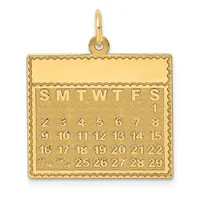 Gold calendar pendant with decorative scalloped border and loop, displaying days of the week abbreviations and numbered dates arranged in rows.